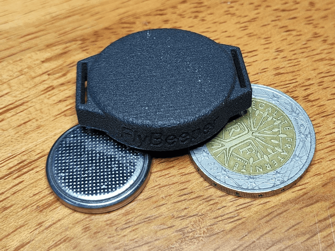 FlyBeeper PS1 enclosure render with the two mounting lugs