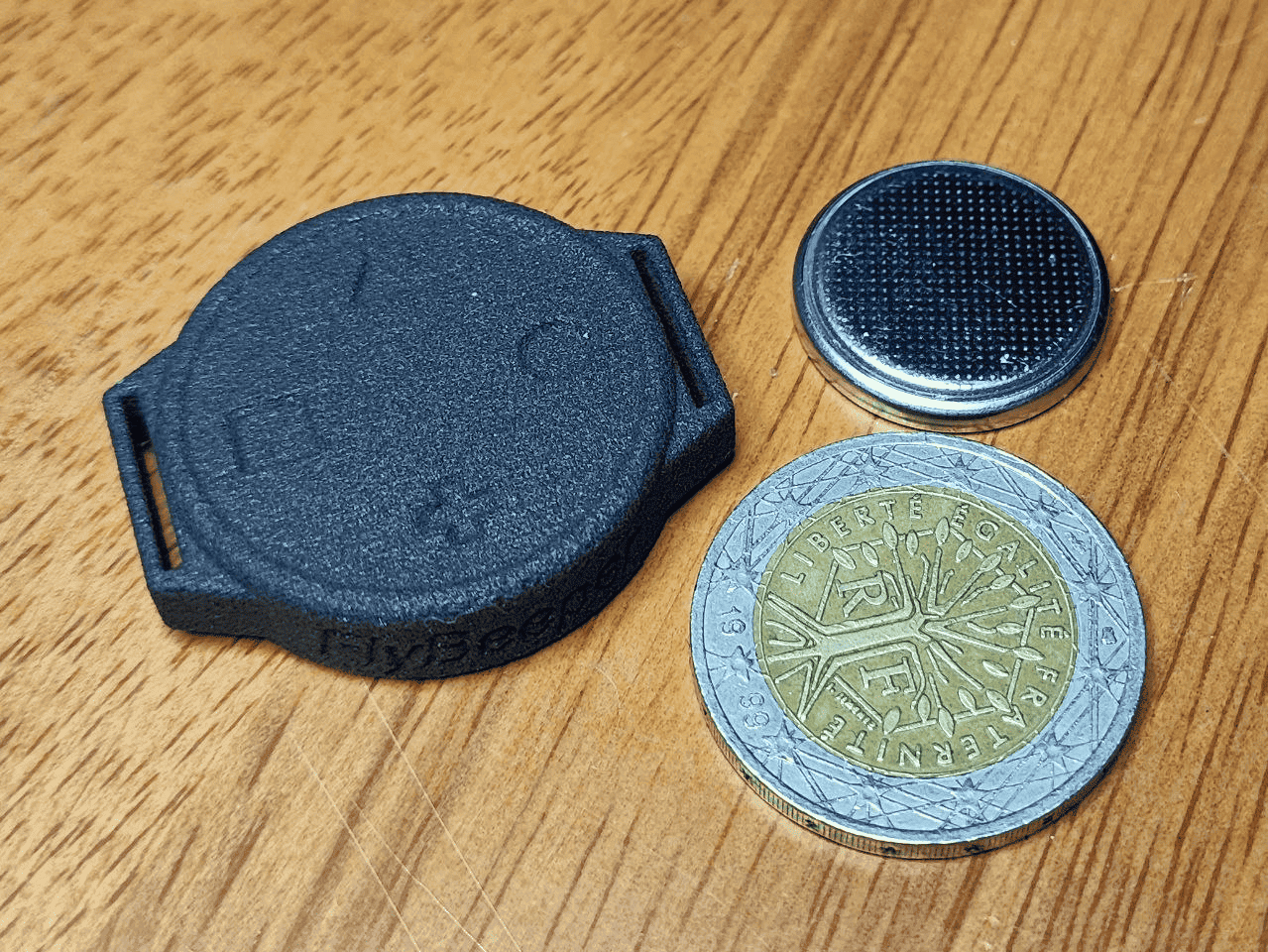 FlyBeeper RC4 enclosure mounted on a paraglider brake handle